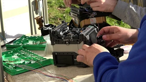 Close-up on the Man hands of the working with Optical fibre communication panel Stock Footage 83548600