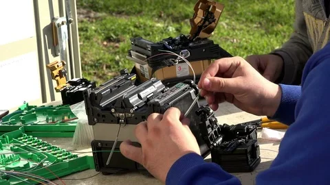 Close-up on the Man hands of the working with Optical fibre communication panel Stock Footage 83548742