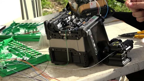 Close-up on the Man hands of the working with Optical fibre communication panel Stock Footage 83548812