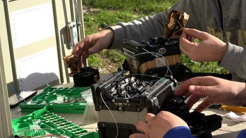Close-up on the Man hands of the working with Optical fibre communication panel Stock Footage 83549209