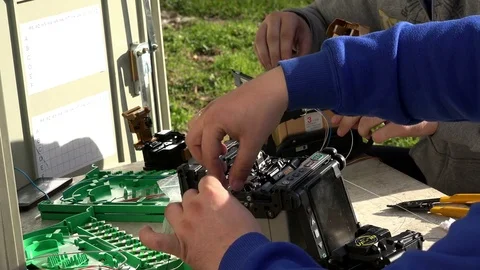 Close-up on the Man hands of the working with Optical fibre communication panel Stock Footage 83549373