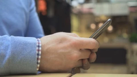 Close up on man hands writing sms, chatting on social media smartphone 動画素材 73077347