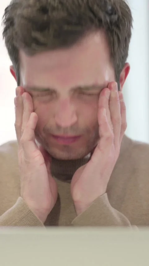 Close Up of Man having Headache while using Laptop, Vertical Video Stock Footage 337351449