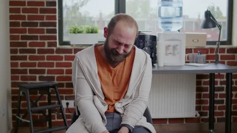 Close up of man having mental breakdown and crying with people at aa therapy Stock Footage 165335872