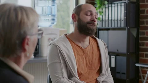 Close up of man having mental breakdown and talking about addiction at aa Stock Footage 166110296