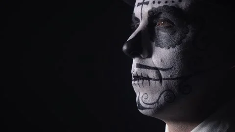 Close up of a man with his face painted as a skull, Santa Muerte, 4k Stock Footage 138425740