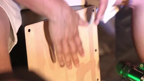 Close-up, a man with his hands plays the cajon during an acoustic rock concert Stock Footage 200795711