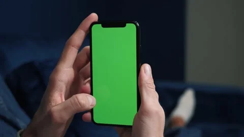 Close up man holding in arms electronics gadget with greenscreen touchpad Video stock 144078969