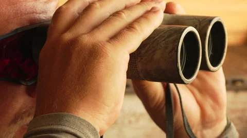 Close Up of a Man Holding Binoculars Stock Footage 285136343