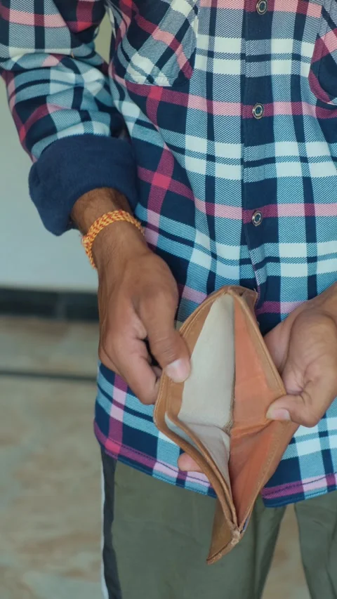 Close up of a man holding an empty leather wallet Video stock 332654681