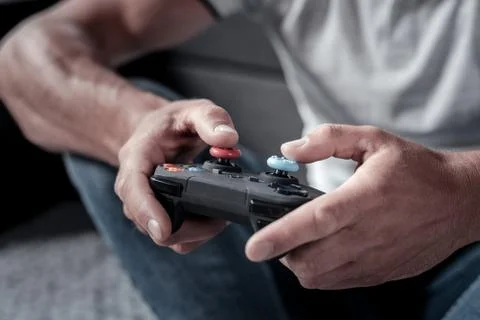 Close up of man holding game controller Stock Photos
