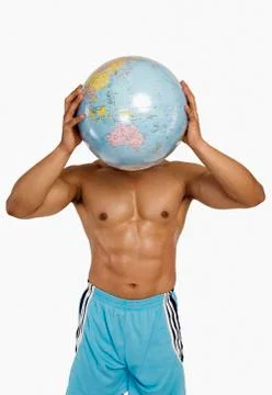 Close-up of a man holding a globe Stock-Fotos