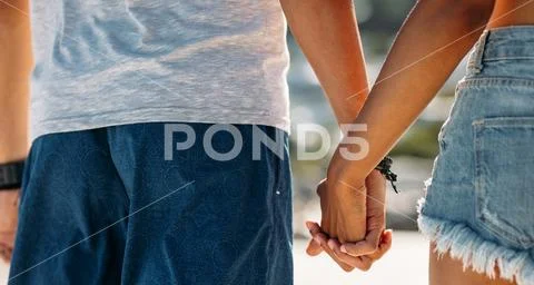 Close Up Of A Man Holding Hand Of A Woman