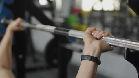 Close-up of a man holding his hands with a barbell for pulling, squatting Stock Footage 194829683