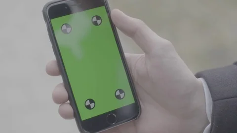 Close up of man holding a Iphone with green screen Stock Footage