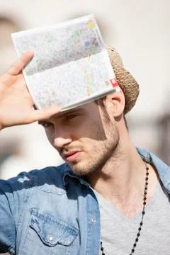Close-up of a man holding a map, Paris, Ile-de-France, France 스톡 사진