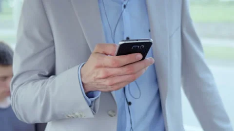 Close-up of man holding a smartphone Stock-Footage 67106163