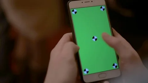 Close Up Man Holding Smartphone slide Touch With Green Screen in the Theatre Stock Footage 73564909