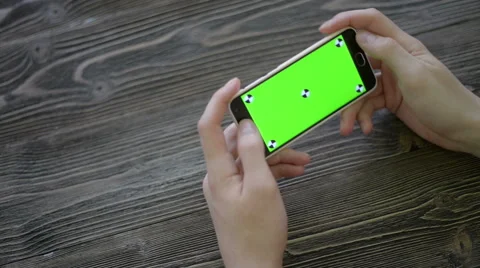 Close Up Man Holding Smartphone Touch Screen With Green Screen Chroma Key For Stock Footage 62566956