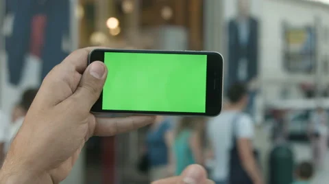 Close Up Man Holding Smartphone Touch Screen With Green Screen Chroma Key For Stock Footage 66947378