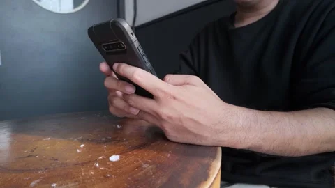 Close Up Man Holding Smartphone Typing Message On Cafe Table Stock Footage Stock Footage 341396066