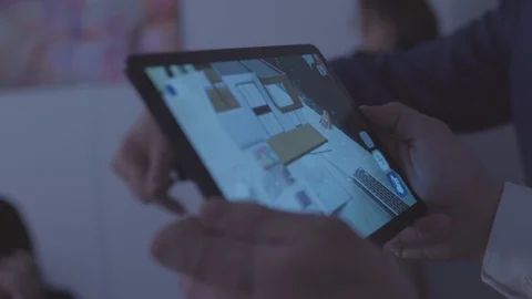 Close-up of man holding a tablet and using the home design program. Stock Video stock 101355434