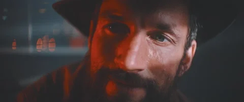 Close up of man holding vintage camera in red lights Stock Footage 203567669
