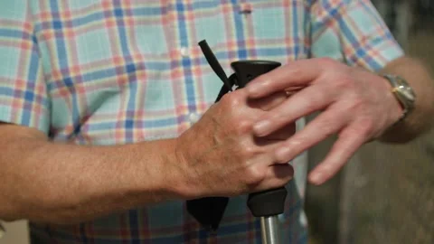 Close up of Man holding Walking Stick  Vídeos de archivo 144608943