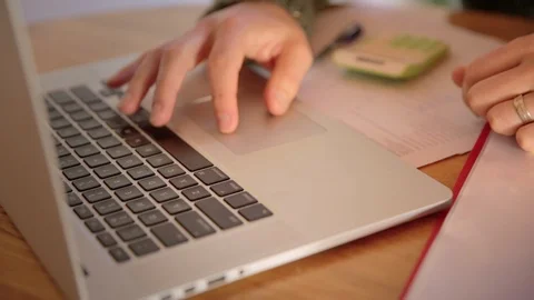 Close up of man at home doing budgeting on a laptop Stock Footage 126560527