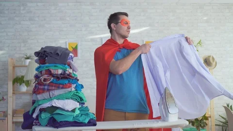 Close up man householder superhero strokes clothes Stock Footage 106950629
