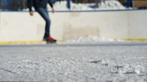 CLOSE- UP: Man ice skating and stopping Stock Footage 92761542
