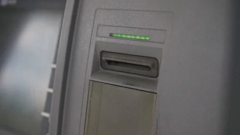 Close up man inserts a credit card into an ATM to check his money balance Stock Footage 129809717