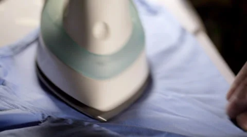 Close up of man ironing shirt Stock Footage 34284418