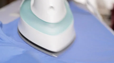 Close up of man ironing shirt Stock Footage 34284670
