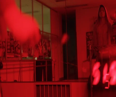 Close up of man jumping over skipping rope in red light, Japan Stock Footage 147046380