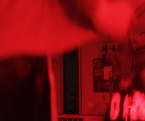 Close up of man jumping over skipping rope in red light, Japan Video stock 147046608