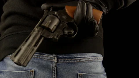 Close-up, man with leather gloves hiding gun behind your back Stock Footage 150390052