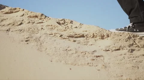 Close-up of  man leg/shoe going alone in the desert. Stock Footage 56058071
