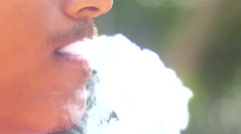 Close-up of a man lighting a cigarette and inhaling. Stock Footage 62854202