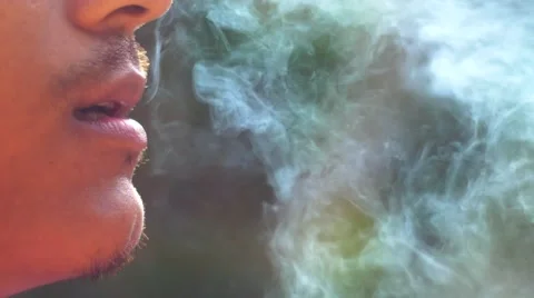 Close-up of a man lighting a cigarette and inhaling. Stock Footage 62854207