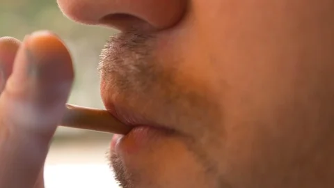 A close-up, a man lights a cigarette. 4k, slow motion Video stock 91834590