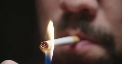 Close Up Man Lights Cigarette and Smokes Stock Footage 82623187