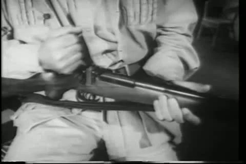 Close-up man loading rifle Stock Footage 11348980