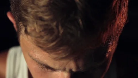 Close-up of man looking at camera Stock Footage 77876477