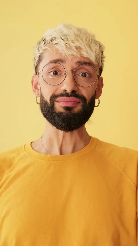 Close-up of man looking at camera sharing emotions on camera for video blog, Stock Footage 254914677