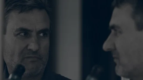 Close up of a man looking in the mirror being lonely and depressed and drinking Stock Footage 105930974