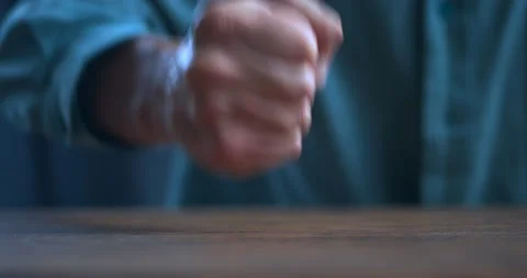 Close up man lose temper, aggressive male clenches his hand into a fist and Stock Footage 229459337