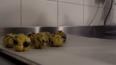 Close-up of a man making chocolate chip cookies. Stock Footage 280182606