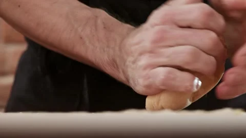 Close-up of man making pasta dough. Chef kneading dough Stock Footage 150768054