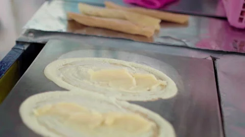 Close up man making thai local custard pancakes 100fps Stock Footage 156172174